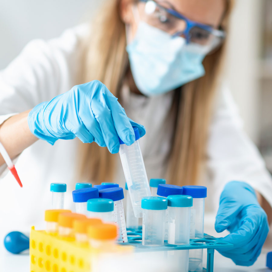 Researcher working with test tubes