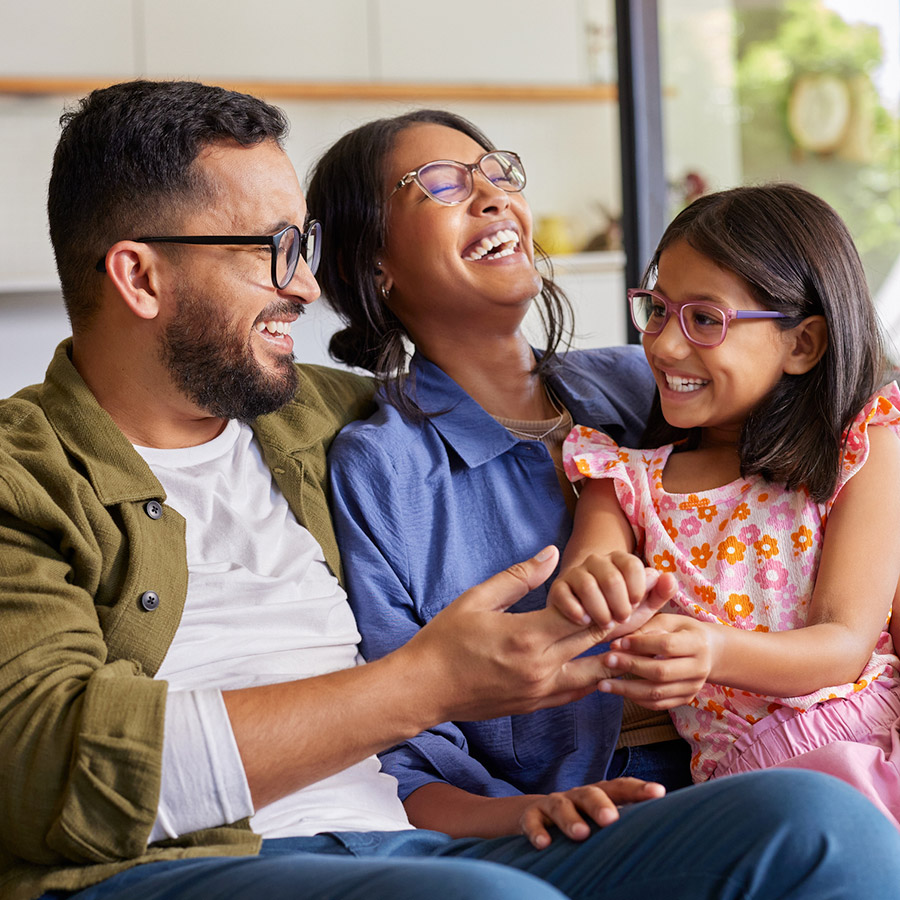 A happy family sitting indoors